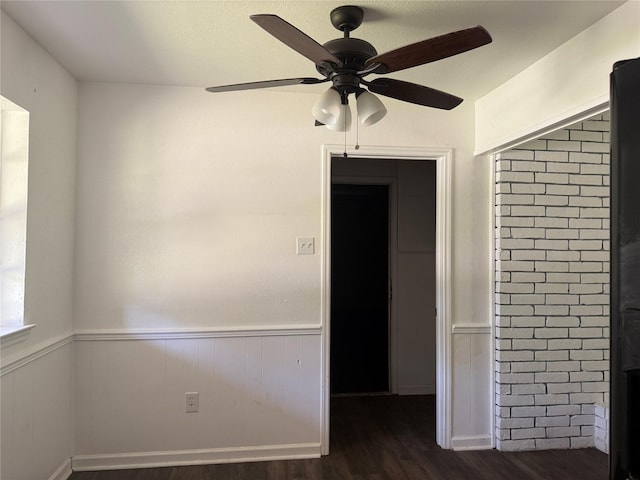 290 Dickard St, Hawkins, TX 75765 - empty room with a ceiling fan, wainscoting, and wood finished floors