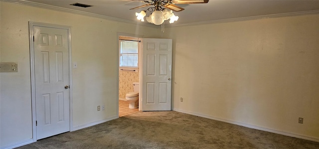 2 Woodfern Ln, Haughton, LA 71037 - unfurnished bedroom featuring visible vents, ornamental molding, baseboards, ensuite bathroom, and carpet flooring