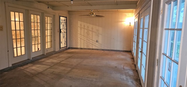 2 Woodfern Ln, Haughton, LA 71037 - spare room with a healthy amount of sunlight, a ceiling fan, french doors, and wood walls