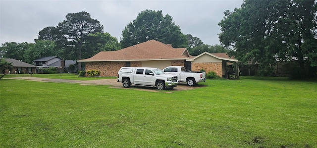2 Woodfern Ln, Haughton, LA 71037 - view of home's exterior featuring a lawn, an attached garage, concrete driveway, and brick siding