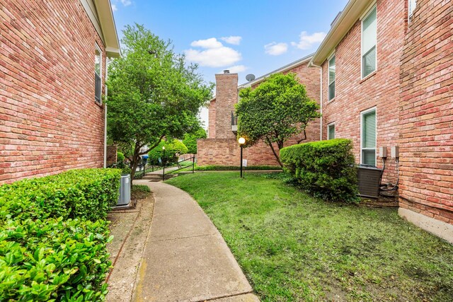 7510 Holly Hill Dr Unit 154, Dallas, TX 75231 - view of yard with fence and cooling unit