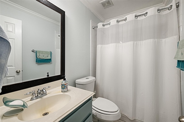 bathroom featuring crown molding, toilet, visible vents, and vanity
