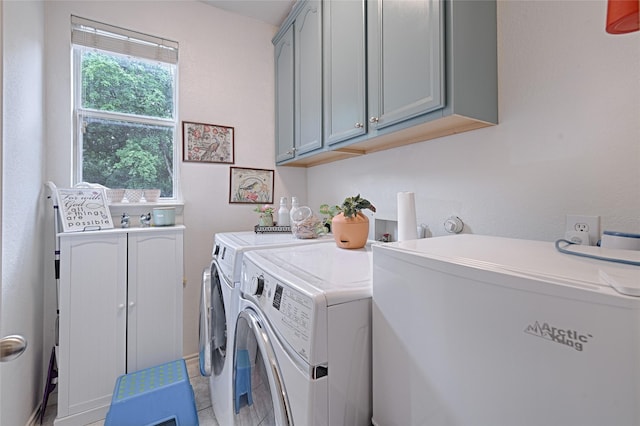 laundry room with cabinet space and washing machine and dryer