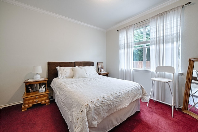 bedroom featuring crown molding, baseboards, and dark colored carpet
