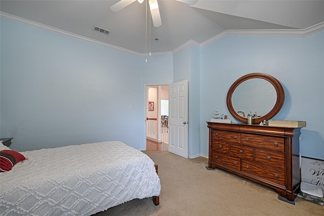 bedroom featuring visible vents, crown molding, ceiling fan, light colored carpet, and vaulted ceiling