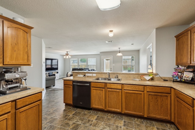 2041 Lake Trail Dr, Heartland, TX 75126 - kitchen featuring a sink, dishwasher, brown cabinets, and open floor plan
