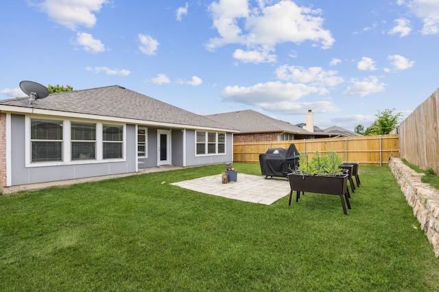 2041 Lake Trail Dr, Heartland, TX 75126 - rear view of house featuring a fenced backyard, a shingled roof, a lawn, and a patio area