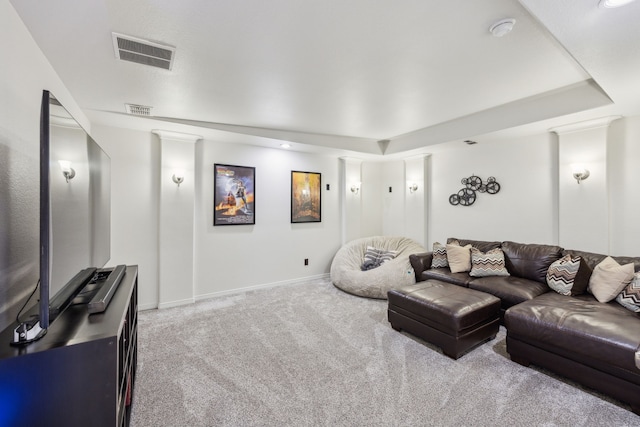 living room featuring visible vents, baseboards, and carpet floors