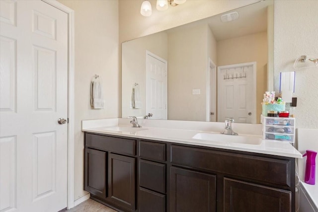 bathroom featuring double vanity and a sink