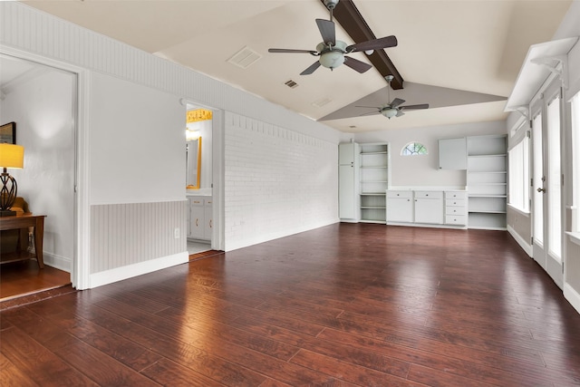 unfurnished living room with wood-type flooring, a ceiling fan, visible vents, and vaulted ceiling with beams