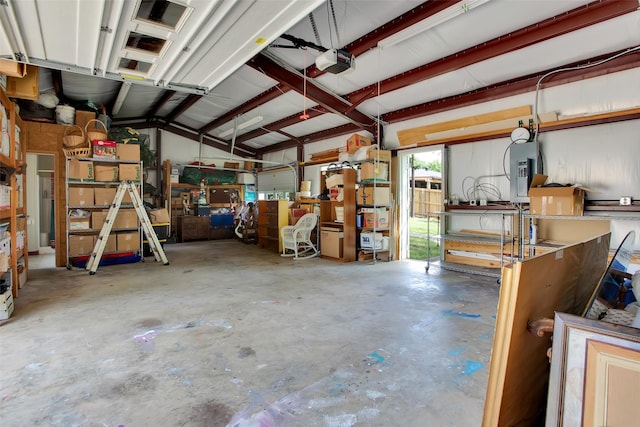 garage featuring a garage door opener and electric panel