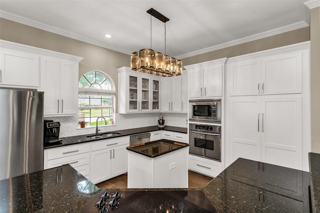 504 Glenbrook Ct, Southlake, TX 76092 - kitchen with a sink, stainless steel appliances, white cabinetry, backsplash, and glass insert cabinets
