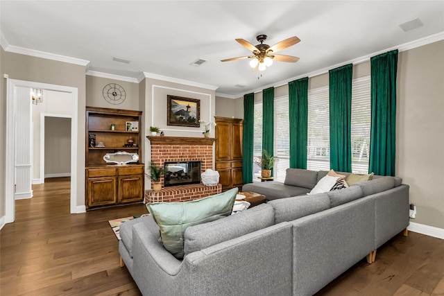 504 Glenbrook Ct, Southlake, TX 76092 - living area with ceiling fan, a brick fireplace, baseboards, dark wood-style floors, and ornamental molding