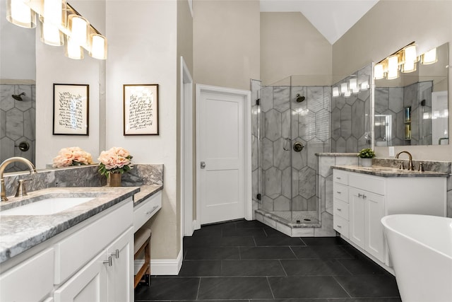 504 Glenbrook Ct, Southlake, TX 76092 - bathroom featuring a sink, lofted ceiling, a stall shower, and two vanities
