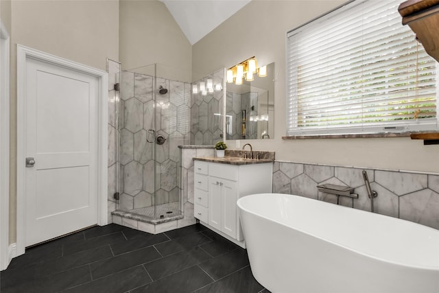 504 Glenbrook Ct, Southlake, TX 76092 - full bathroom with a freestanding tub, tile patterned flooring, a stall shower, vanity, and lofted ceiling