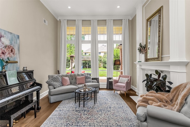504 Glenbrook Ct, Southlake, TX 76092 - living area featuring crown molding, visible vents, a healthy amount of sunlight, and wood finished floors