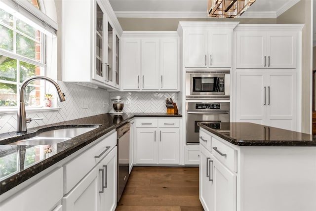 504 Glenbrook Ct, Southlake, TX 76092 - kitchen with a sink, appliances with stainless steel finishes, white cabinets, and ornamental molding