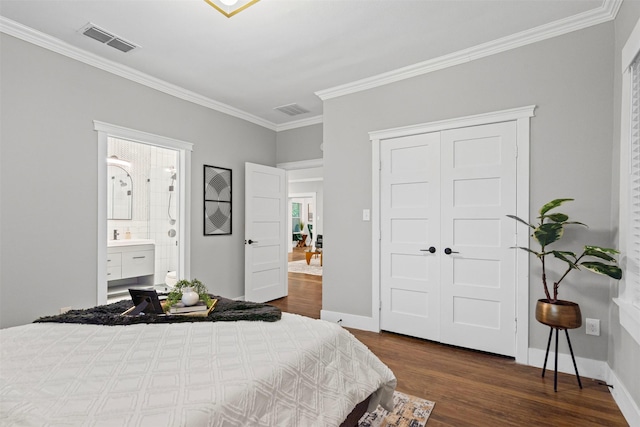 bedroom with ornamental molding, dark wood-style floors, and visible vents