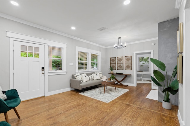 living area featuring visible vents, light wood finished floors, a notable chandelier, recessed lighting, and a wealth of natural light