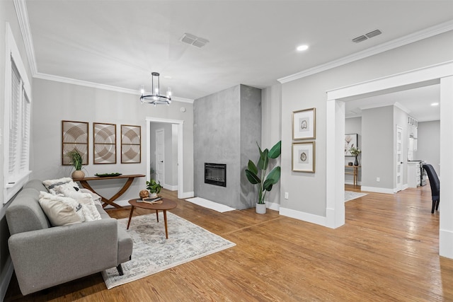 living room featuring light wood-style floors and visible vents