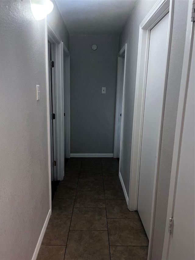 2551 Mossglen Dr, Dallas, TX 75227 - hall with tile patterned floors and baseboards