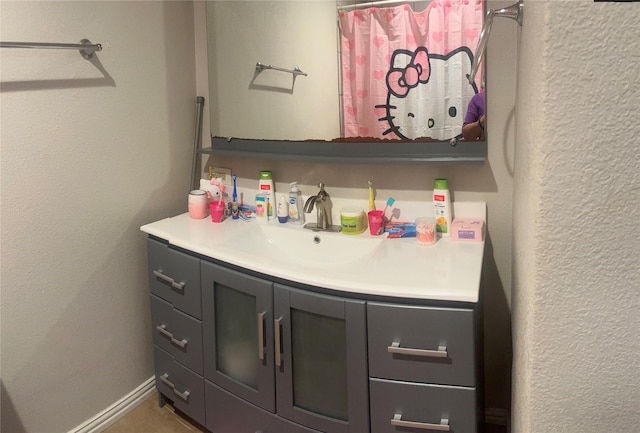 2551 Mossglen Dr, Dallas, TX 75227 - bathroom featuring vanity and a textured wall