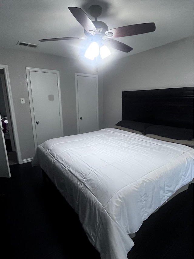2551 Mossglen Dr, Dallas, TX 75227 - bedroom featuring ceiling fan and dark wood-style floors