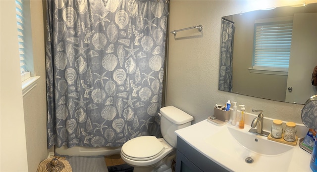 2551 Mossglen Dr, Dallas, TX 75227 - bathroom with toilet and vanity