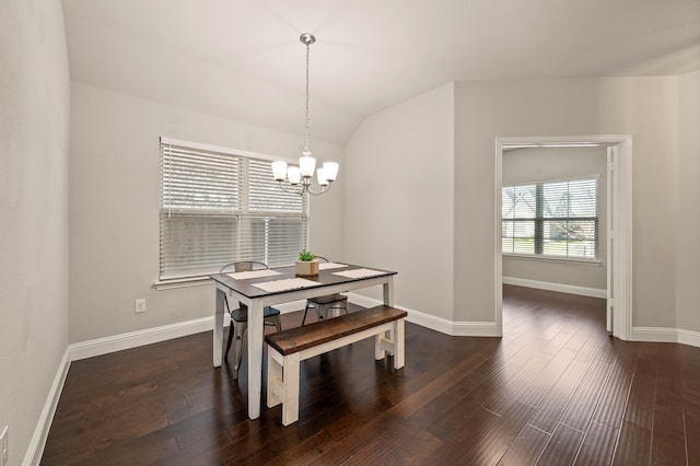 dining area featuring an inviting chandelier, baseboards, dark wood-style floors, and vaulted ceiling