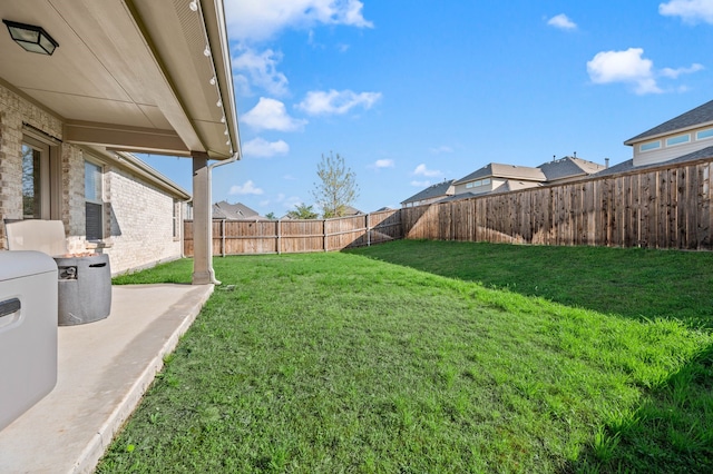 view of yard with a fenced backyard and a patio area