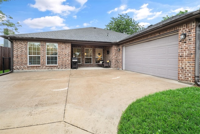 3050 Kinkaid Dr, Dallas, TX 75220 - back of house with brick siding, driveway, an attached garage, and roof with shingles