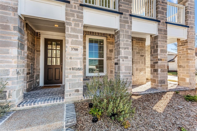 property entrance with stone siding