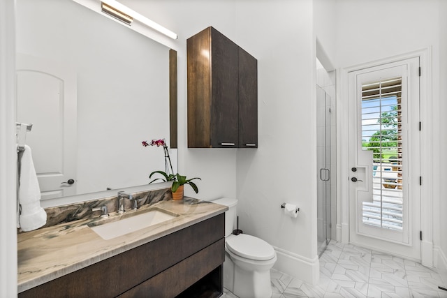 bathroom featuring a shower stall, vanity, baseboards, toilet, and marble finish floor