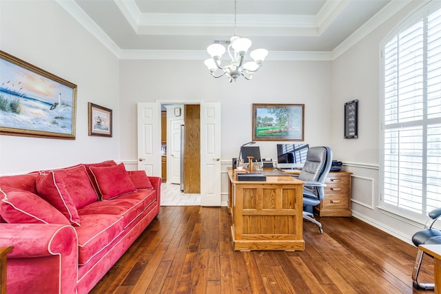office area with crown molding, a tray ceiling, dark wood finished floors, and a chandelier