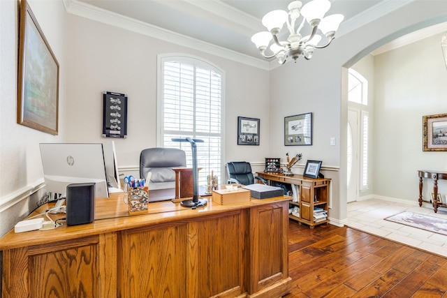 office featuring crown molding, arched walkways, dark wood-type flooring, and a chandelier