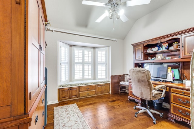 office area with wood-type flooring, a ceiling fan, and lofted ceiling