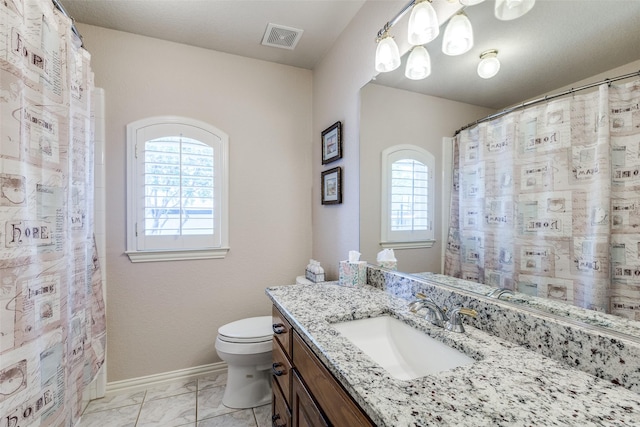 full bathroom featuring visible vents, vanity, marble finish floor, toilet, and baseboards