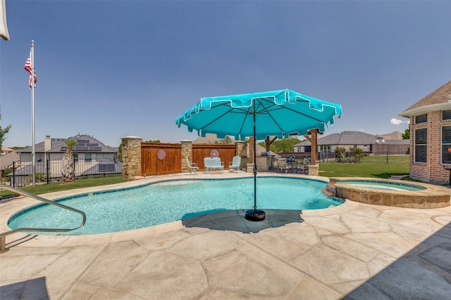 view of swimming pool featuring a residential view, a pool with connected hot tub, a fenced backyard, a patio area, and a yard
