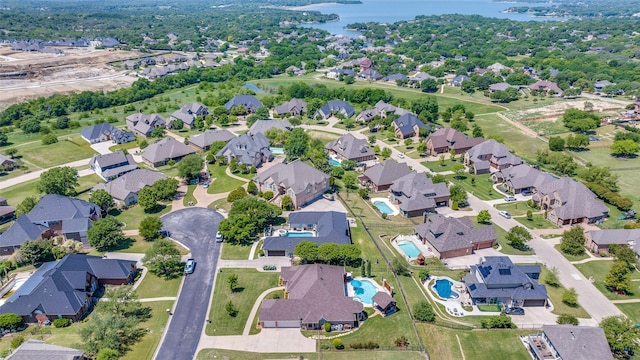 bird's eye view featuring a residential view and a water view