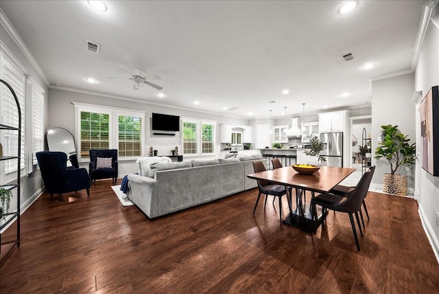 729 Rockwood St, Dallas, TX 75203 - dining room featuring a ceiling fan, crown molding, recessed lighting, dark wood finished floors, and baseboards