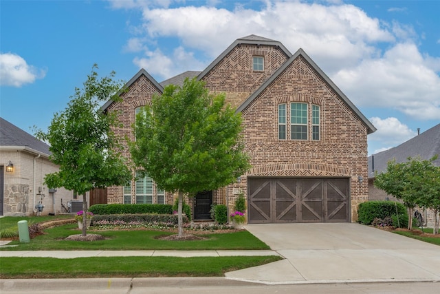 view of front of property with an attached garage, driveway, and brick siding