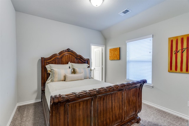 bedroom featuring visible vents, multiple windows, and carpet