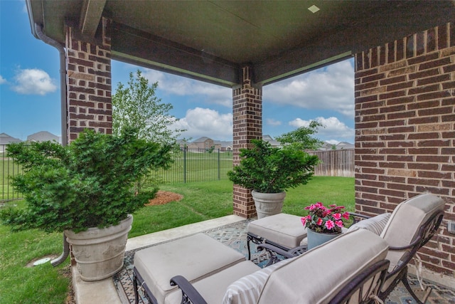 view of patio featuring an outdoor living space and a fenced backyard