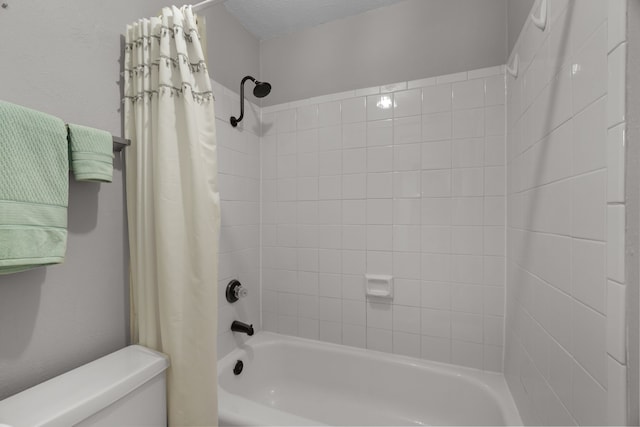 full bath featuring toilet and shower / bath combination with curtain
