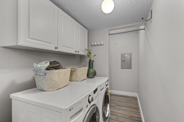 clothes washing area featuring baseboards, dark wood-style floors, a textured ceiling, cabinet space, and independent washer and dryer