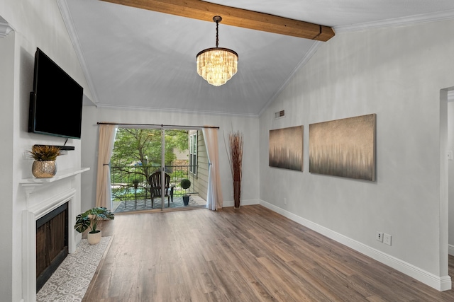 unfurnished living room featuring an inviting chandelier, baseboards, vaulted ceiling with beams, and wood finished floors