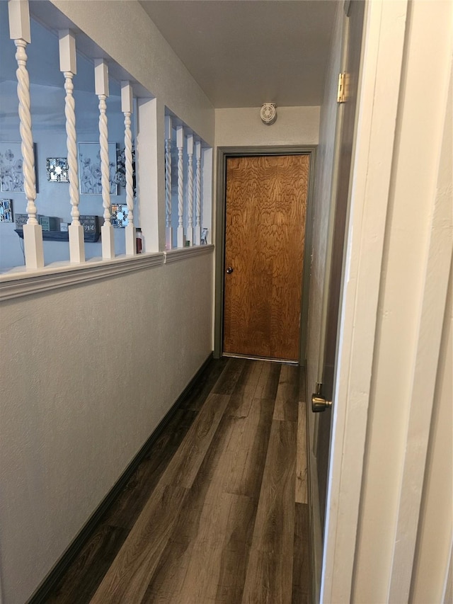 corridor with dark wood-type flooring
