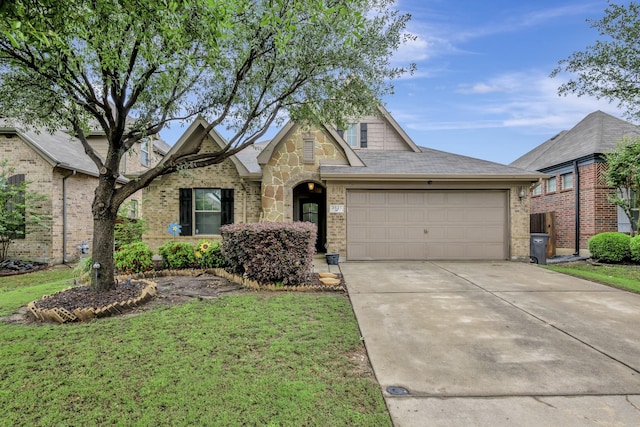 view of front of house with concrete driveway, brick siding, a front yard, and a garage
