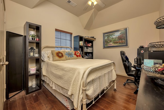 bedroom with visible vents, a ceiling fan, wood finished floors, and vaulted ceiling