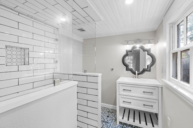 full bathroom featuring walk in shower, vanity, tile patterned floors, wooden ceiling, and visible vents